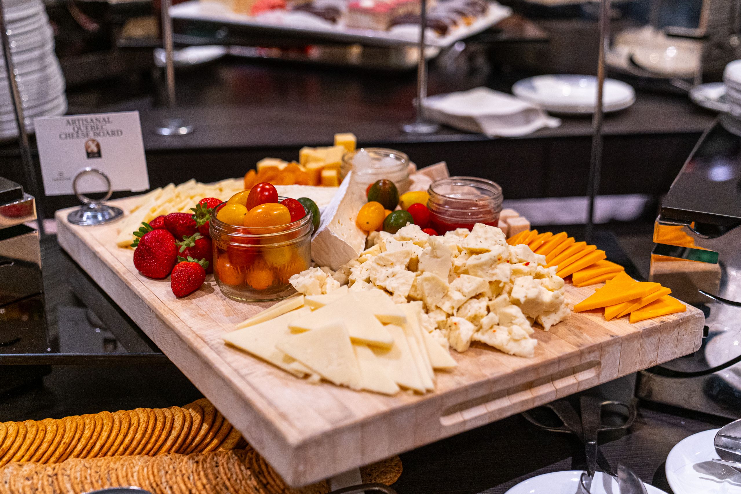 Cheese board with brie and jars